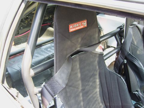 2007 Ford Mustang - Close-up of a racing seat with a Kirkey logo, part of a roll cage visible inside the vehicle.