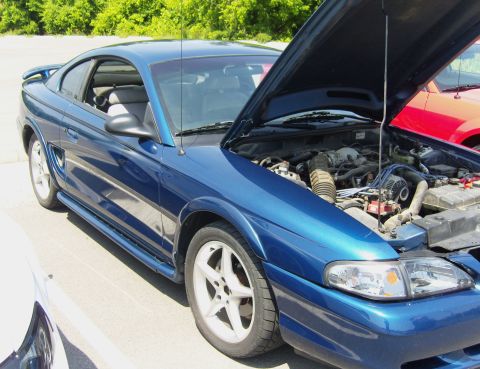 2007 Ford Mustang - Blue 1994 Ford Mustang coupe with hood open, parked outdoors. Another vehicle is partially visible.