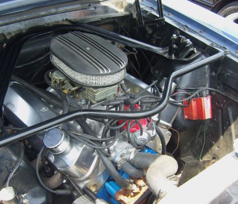2007 Ford Mustang - Close-up view of a V8 engine bay, a chrome air cleaner and a red ignition box.