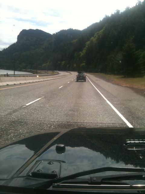 2005 Jeep Wrangler - Driving on a highway with mountains and trees in the background.