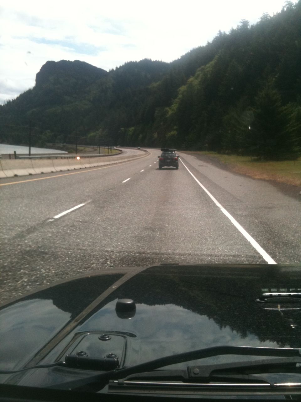 2005 Jeep Wrangler driving on highway with another vehicle ahead