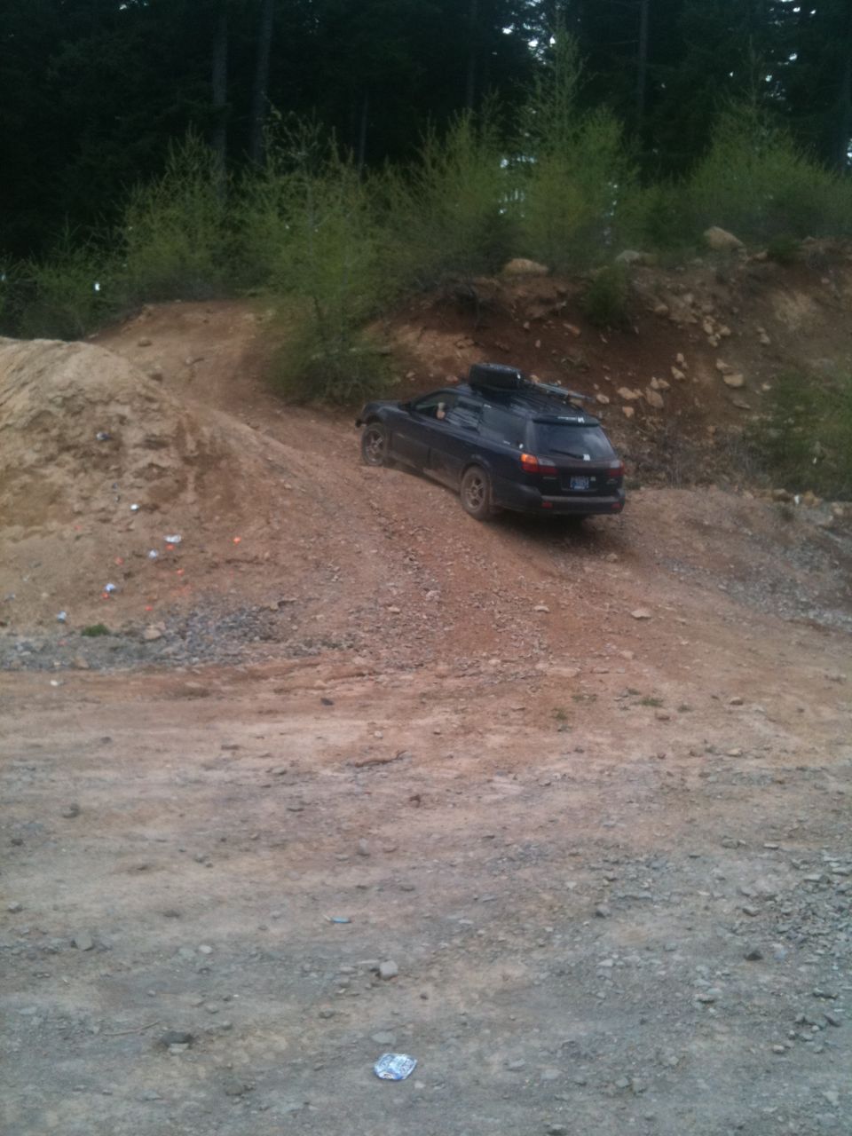 Heading up to try a hill climb,
I took my Jeep around through the briars on the other side of the trail to pull him through the toughest part. He could not back down at that point.
Teamwork ensued,