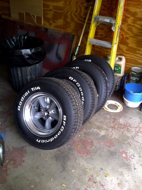 1971 Ford Ranchero - A set of four BFGoodrich Radial T/A tires with polished aluminum wheels are stored in a garage.
