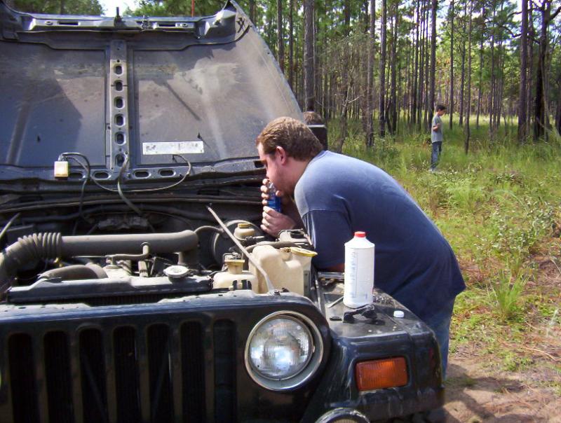 A jeep owner who loves his jeep.  Clutch line burned though due to open headers.