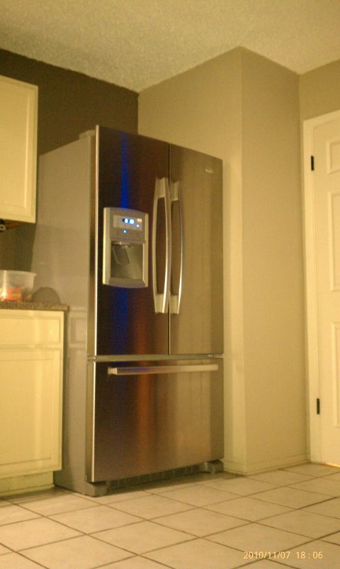 1983 Ford 427 - This is a stainless steel refrigerator with a French door style and a bottom freezer drawer.