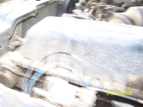 1989 Ford Bronco - A close-up view of an engine bay, showing various components and a date stamp of 01/01/2008.