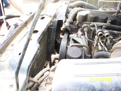 1989 Ford Bronco - Close-up of an engine bay, focusing on the radiator and fan assembly.