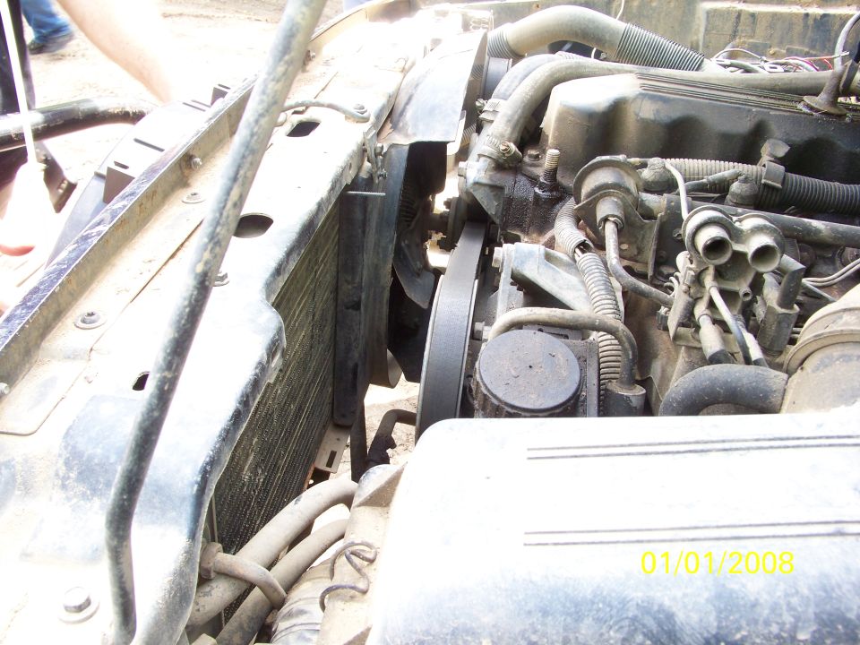 Engine bay showing radiator, fan, and belts. Date stamp reads 01/01/2008