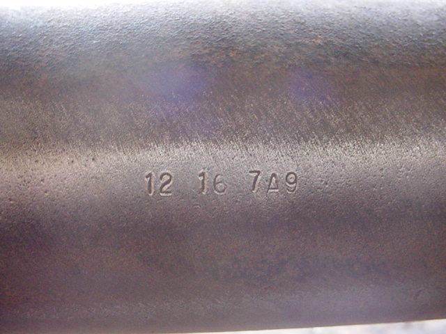 Part with stamped numbers 12 16 7A9