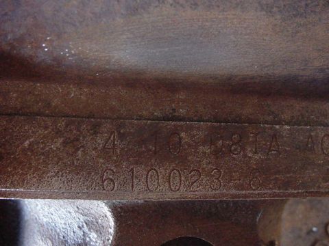 1992 Ford Bronco - This image shows stamped identification numbers on a metal component, not a vehicle.