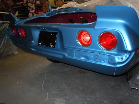 1972 Chevrolet Camaro - The rear of a blue 1970 Chevrolet Camaro is visible, likely in a garage or workshop setting.