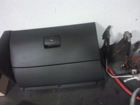 2001 Volkswagen Jetta - A black glove box door with a latch is shown, likely a replacement part.