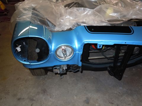 1972 Chevrolet Camaro - Front bumper and headlight assembly for a 1972 Chevrolet Camaro, showing the distinctive styling and black stripe detail.