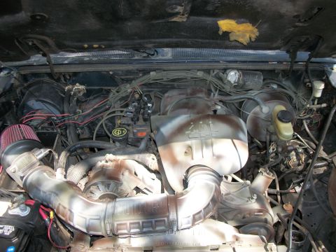 1994 Ford Explorer - Engine bay components are visible, including the air intake system and engine block.
