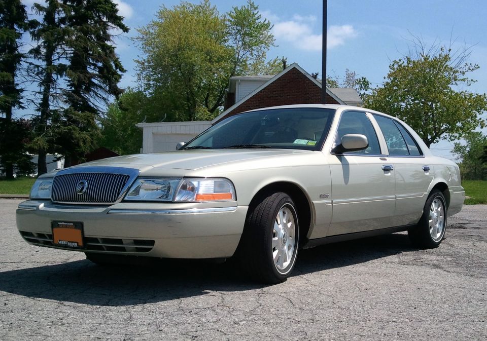 2004 Mercury Grand Marquis, tan sedan, front 3/4 view
