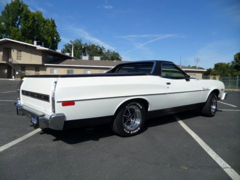 1973 Ford Ranchero - This 1973 Ford Ranchero features a white body with black trim and chrome wheels, seen from a 3/4 front angle.