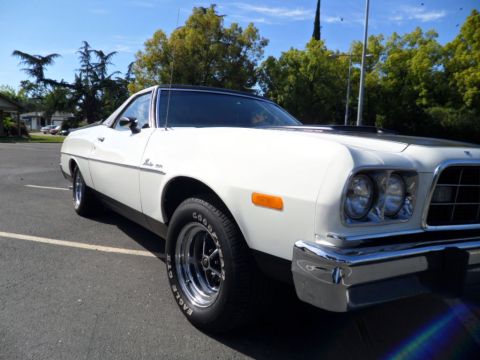 1973 Ford Ranchero - White 1973 Ford Ranchero with black hood accent and chrome bumper.