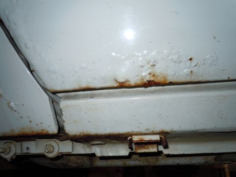 2001 Ford Crown Victoria - Rust is visible on the undercarriage and lower body panels of the vehicle.