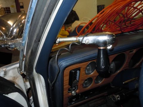 2001 Ford Crown Victoria - Interior view of a car dashboard with an aftermarket shifter and coiled orange cables.