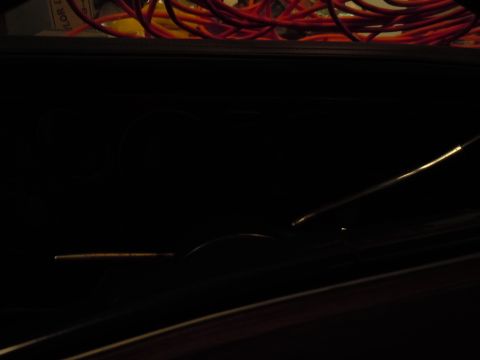 2001 Ford Crown Victoria - Close-up of a car's interior, showing wiring and dashboard details in low light.