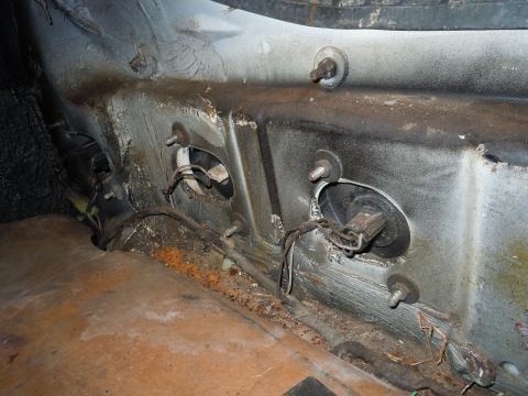2001 Ford Crown Victoria - This image shows the interior of a vehicle's body, with visible rust and electrical components.