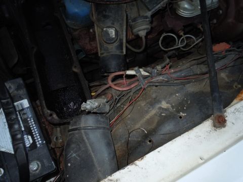 2001 Ford Crown Victoria - Close-up view of engine bay components, including wiring and air intake parts.