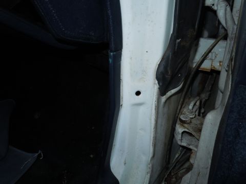 2001 Ford Crown Victoria - Close-up of the interior door jamb area on a 2001 Ford Crown Victoria.