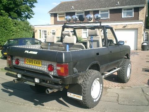 1990 Chevrolet Suburban - This heavily modified Range Rover features off-road tires and a custom rear bumper.