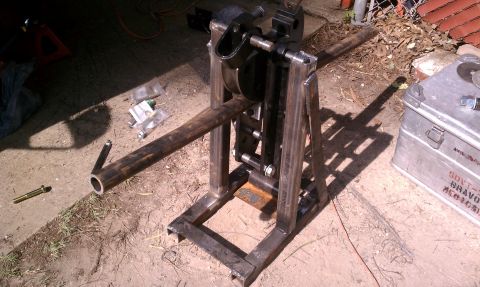 1990 Ford Bronco - A custom metal pipe bending machine is shown outdoors on a dirt surface.