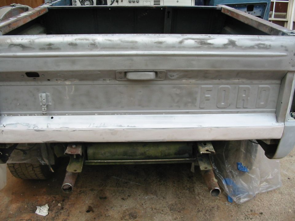 tailgate back from brothers house and patches made. skim coat of bondo over lower edge. no perfect but happy with it!
