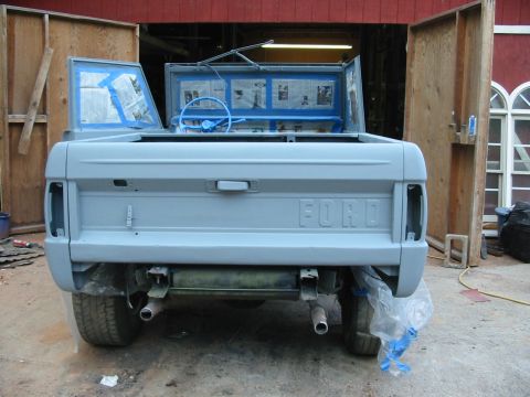 1969 Ford Bronco - This Ford Bronco is being prepped for paint, with its interior taped off and doors ajar.