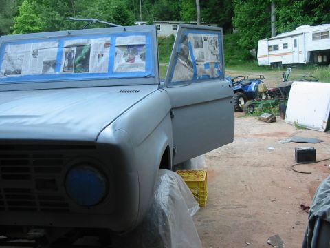 1969 Ford Bronco - This 1969 Ford Bronco is undergoing preparation for a new paint job, with its doors open and windows taped.