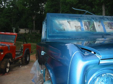 1969 Ford Bronco - Two Ford Broncos are visible, one being prepped for paint and another in the background.