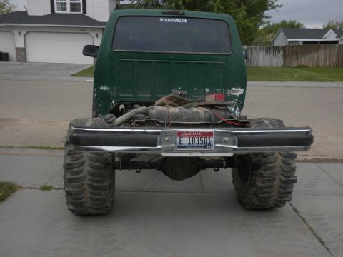 1989 Ford Bronco - Rear view of a modified 1989 Ford Bronco showing its large tires and lifted suspension.
