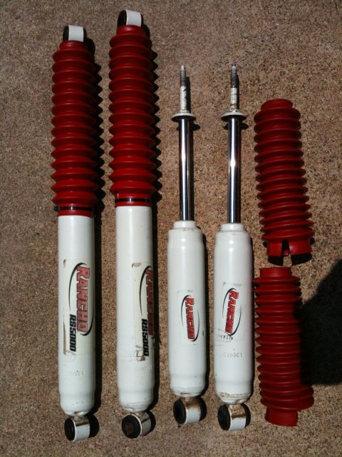 1996 Ford Bronco - Set of Rancho RS5000 shock absorbers and spare red dust boots.