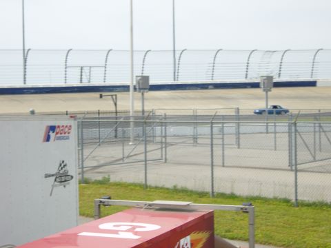2007 Ford Mustang - A blue coupe is seen on the track at a speedway event.