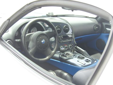 2007 Ford Mustang - Interior view of a Dodge Viper, carbon fiber trim and blue upholstery.