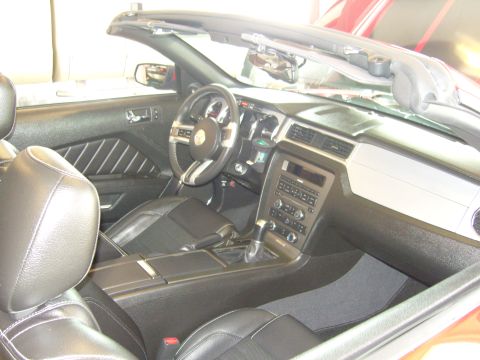 2007 Ford Mustang - Interior view of a 2007 Ford Mustang convertible, highlighting the dashboard and seating.