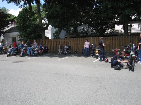 1981 Garelli Rally Sport - A gathering of mopeds in a parking lot on a sunny day.