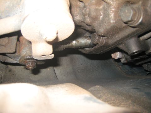 2007 Subaru Impreza - Undercarriage view shows various mechanical components and fasteners, some showing signs of rust and grease buildup.