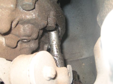 2007 Subaru Impreza - A greasy metal shift linkage is shown in detail, with visible bolts and surrounding components.