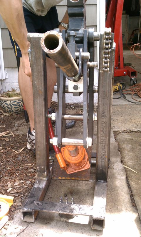 1990 Ford Bronco - A close-up view of a custom-built metal apparatus, possibly for automotive repair, a hydraulic jack.