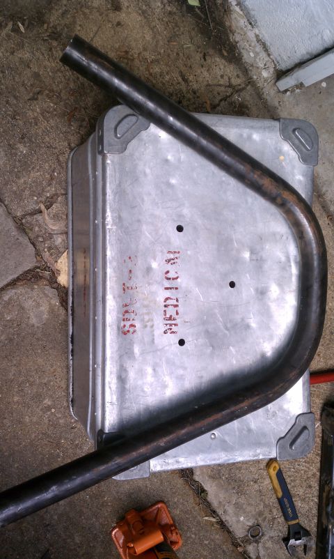 1990 Ford Bronco - A metal box marked 'MEDICAL' sits on the ground next to some tubing and tools.