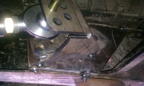 1990 Ford Bronco - Close-up view of a custom suspension component, likely for off-road modification.