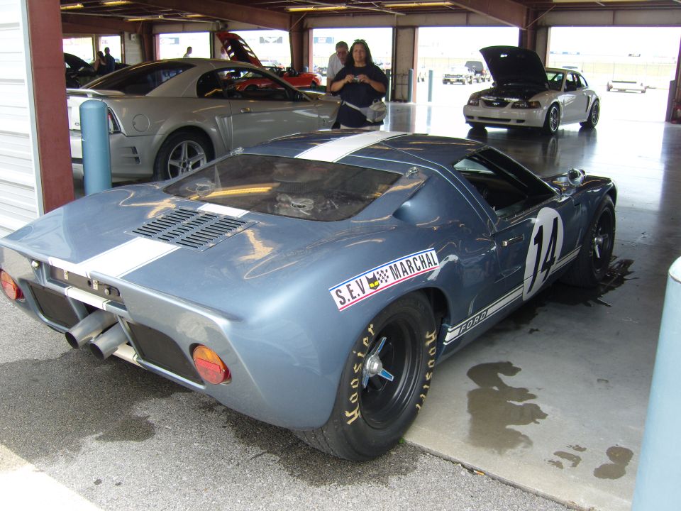 Blue race car with white stripes, number 14, and Hoosier tires