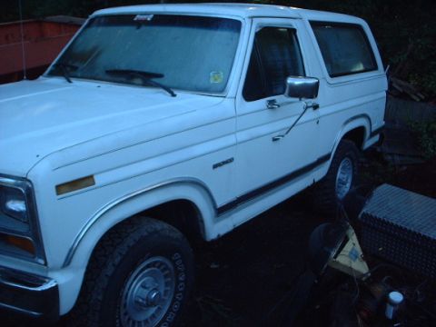 1978 Ford Bronco - This white 1978 Ford Bronco is shown from a 3/4 front angle, highlighting its classic body style.