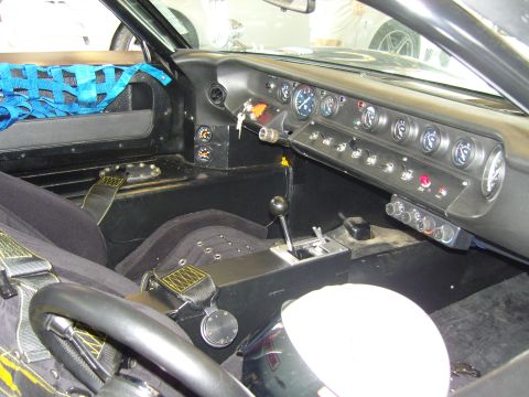 2007 Ford Mustang - Interior view of a race car, custom gauges and safety equipment.