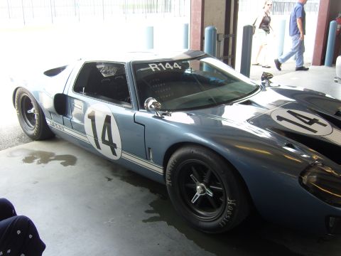 2007 Ford Mustang - A classic Ford GT40 race car is parked indoors, showing its racing livery and Hoosier tires.