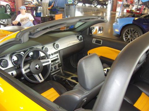 2007 Ford Mustang - Interior view of a yellow convertible with a black and yellow color scheme.