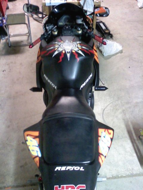 2006 Honda CBR-RR - Rear view of a motorcycle with Repsol branding and racing numbers.
